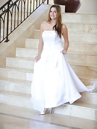 Danielle poses in a long white gown